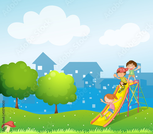 Three kids playing at the playground