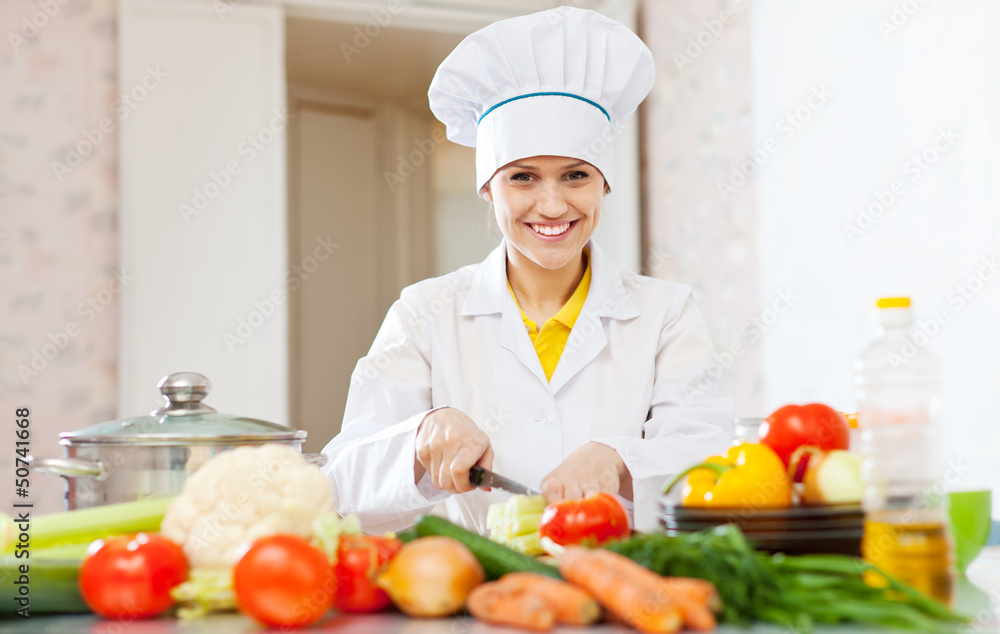 Cook prepares vegetables