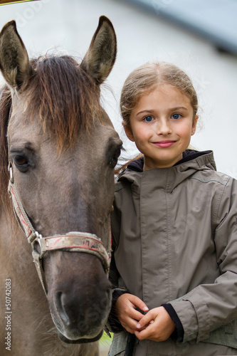 Horse and lovely equestrian girl