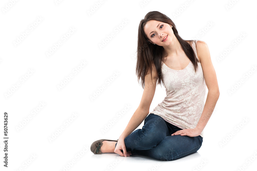 Attractive caucasian girl sitting on floor