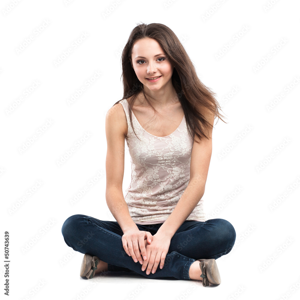 Attractive caucasian girl sitting on floor
