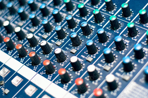 Music mixer in studio, close-up of audio controls