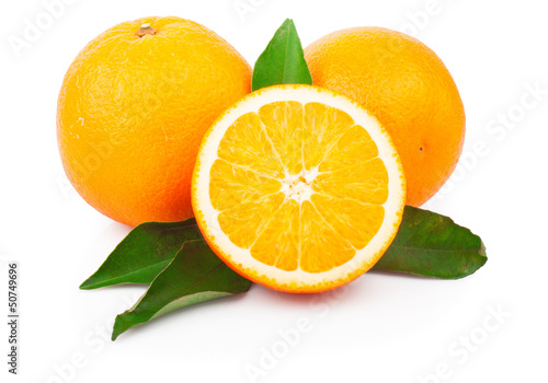 Fresh oranges fruit with green leaves, isolated on white