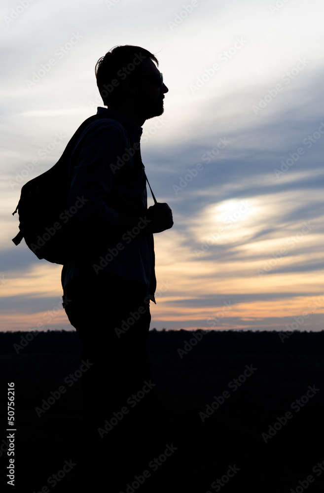 Silhouette of a man with a camera