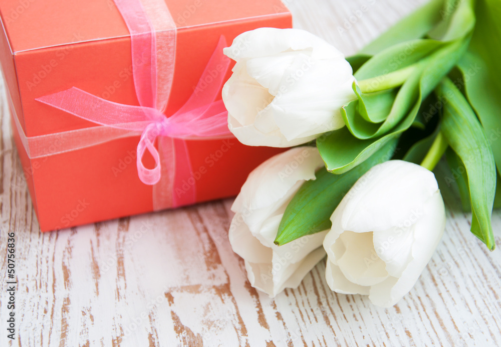 bouquet of tulips, gift box on a table bouquet of tulips, gift box on a table
