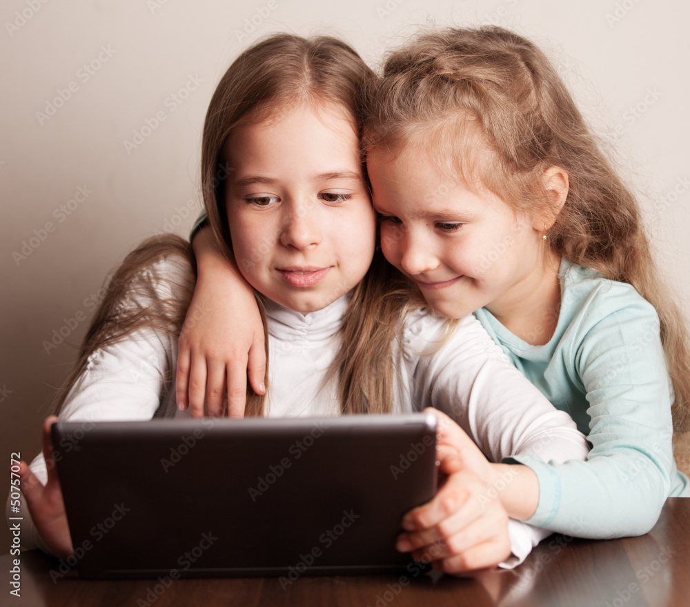 Children playing on tablet Children playing on tablet