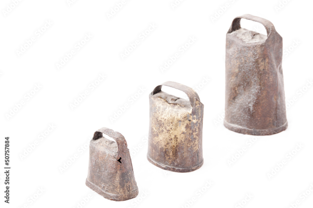 Old and rusty cowbells isolated Old and rusty cowbells isolated