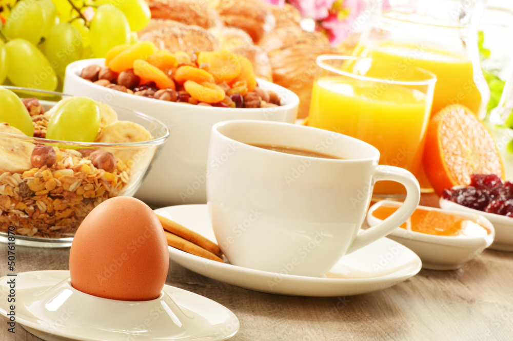 Breakfast including coffee, bread, honey, orange juice, muesli a Breakfast including coffee, bread, honey, orange juice, muesli a