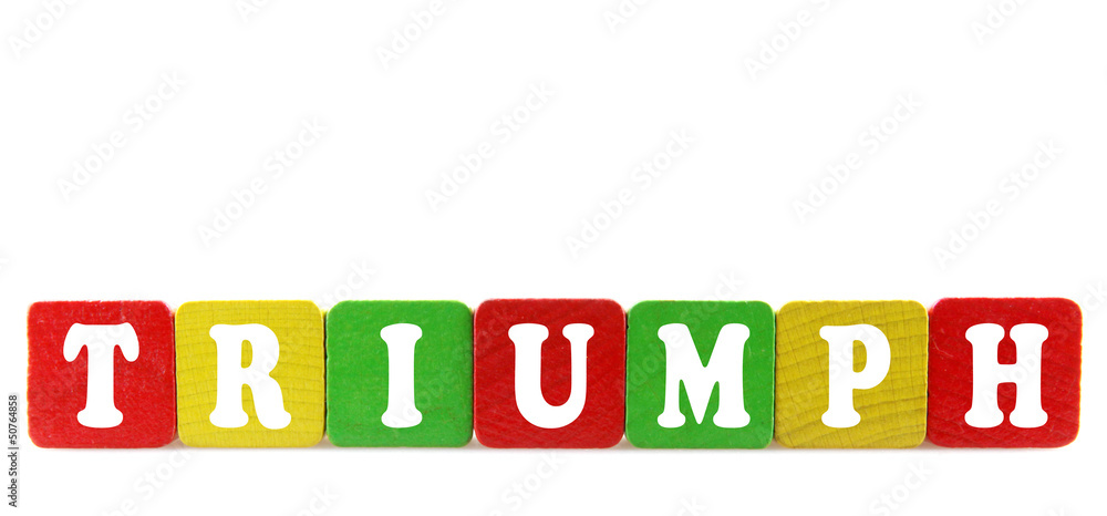 triumph - isolated text in wooden building blocks triumph - isolated text in wooden building blocks