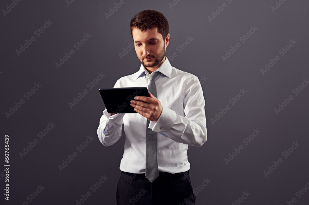 thoughtful businessman using tablet pc thoughtful businessman using tablet pc