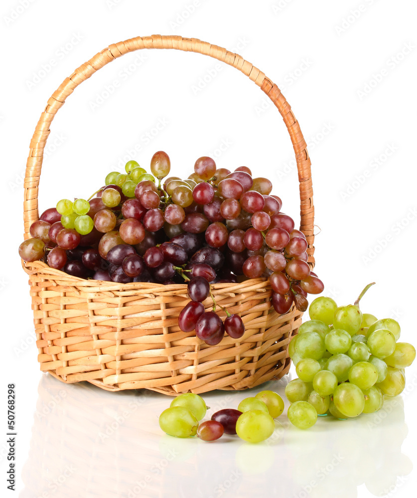 Delicious ripe pink and green grapes in basket isolated on Delicious ripe pink and green grapes in basket isolated on