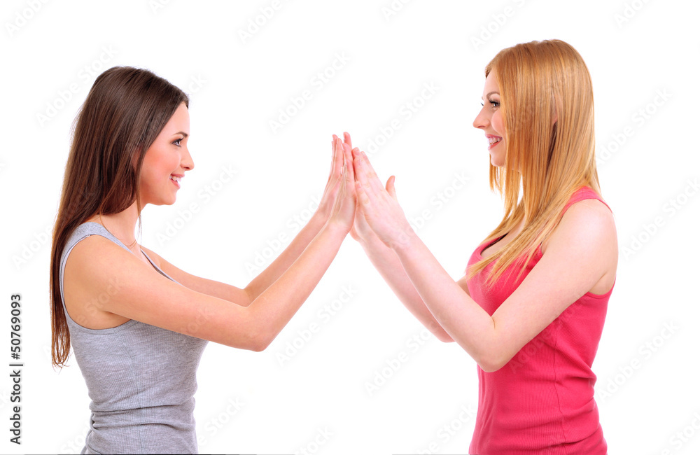 Two girl friends fool around isolated on white Two girl friends fool around isolated on white