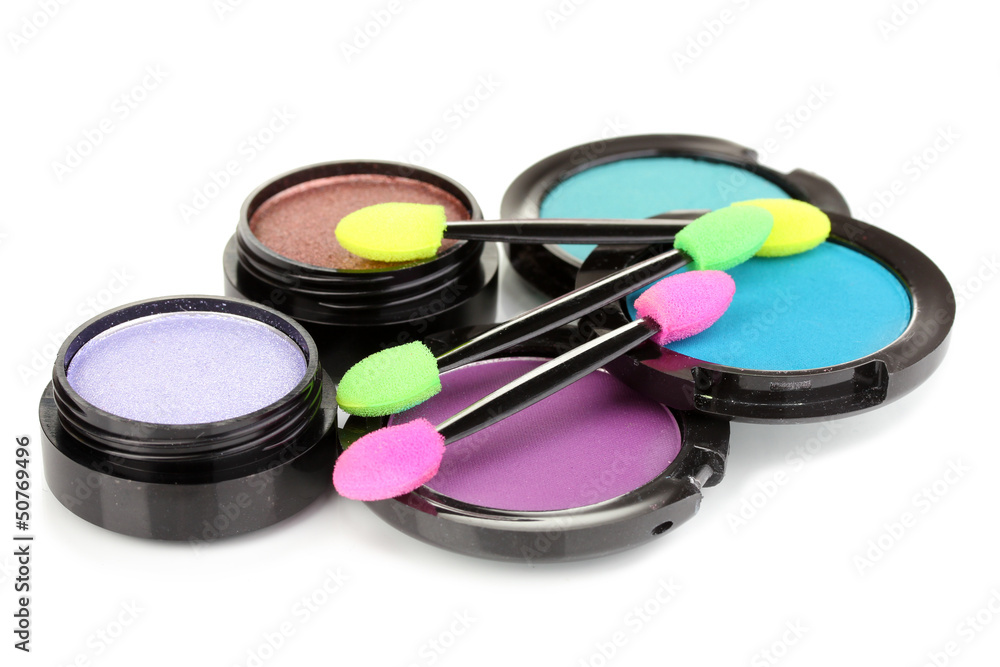 Bright eye shadows and sponge brushes for foundation isolated Bright eye shadows and sponge brushes for foundation isolated