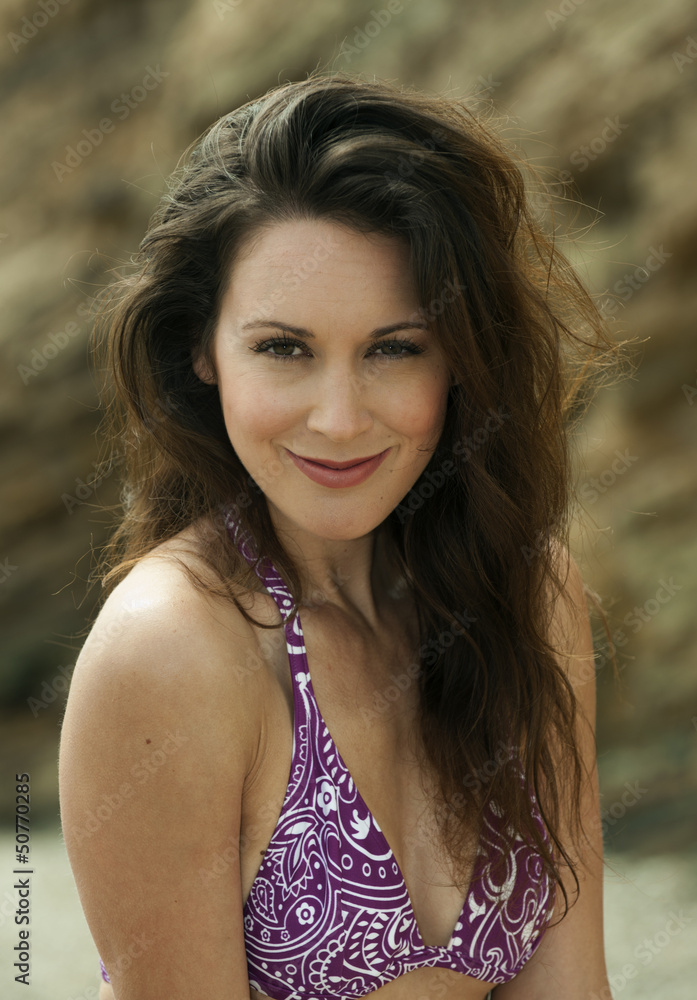 Relaxed attractive brunette girl wearing purple bikini Relaxed attractive brunette girl wearing purple bikini