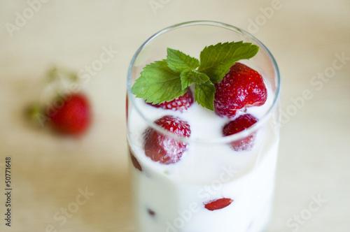 milk with strawberries in a glass