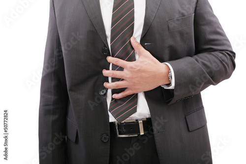 Businessman holding his stomach in pain or indigestion