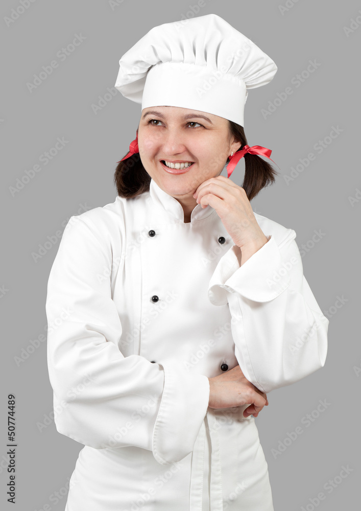 Woman chef in uniform isolated on a gray background. Woman chef in uniform isolated on a gray background.
