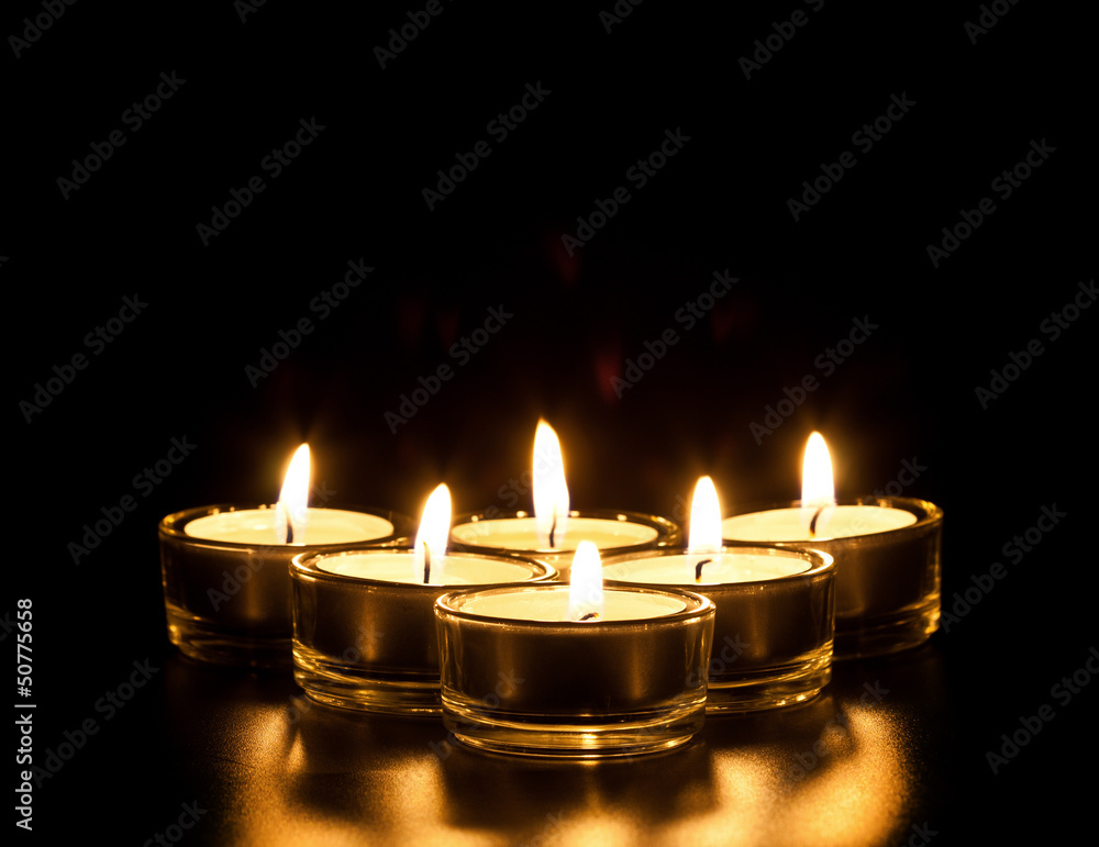 candles on a black background candles on a black background