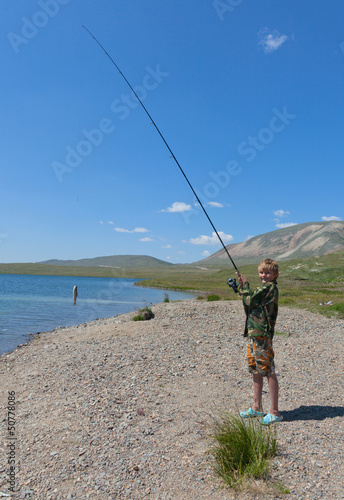 Boy fishing on spinning