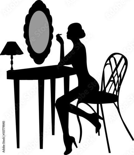 Girl makes make-up in front off mirror silhouette