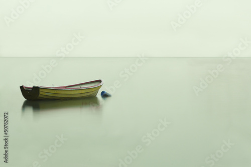Obraz na płótnie Boat on a calm lake