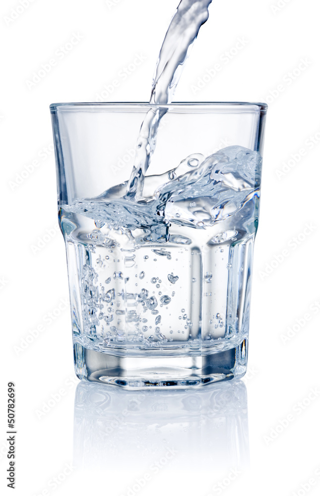 Water pouring into glasses isolated on a white background Water pouring into glasses isolated on a white background