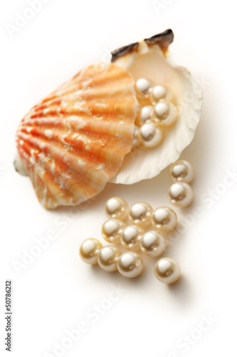 Scattering white pearls in seashell