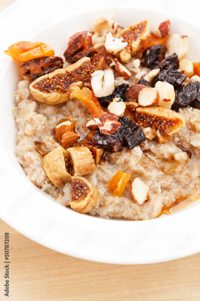 oatmeal with raisins, nuts and maple syrup oatmeal with raisins, nuts and maple syrup