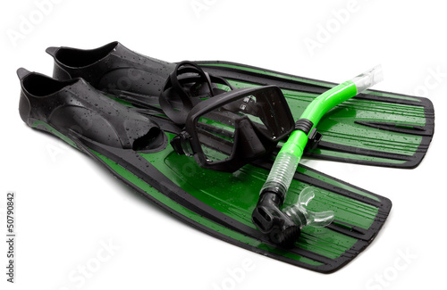 Mask, snorkel and flippers with water drops. Diving gear on whit