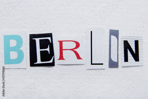 word berlin cut from newspaper on handmade paper