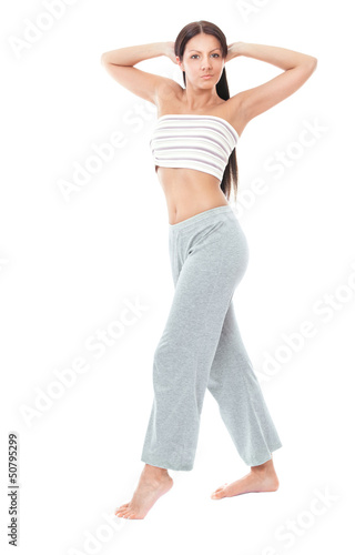 Attractive healthy young woman stretching gym, isolated on white