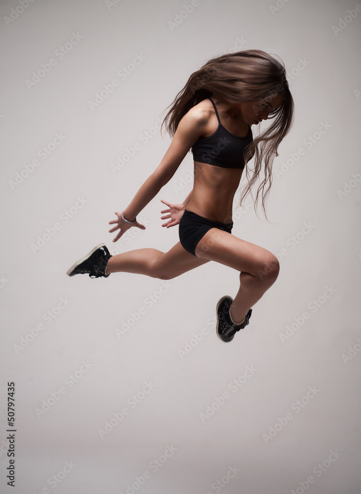 girl doing gymnastick jump girl doing gymnastick jump