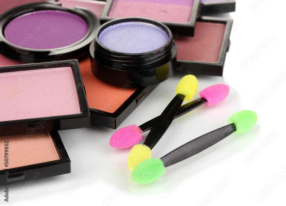 Bright eye shadows and sponge brushes for foundation isolated Bright eye shadows and sponge brushes for foundation isolated