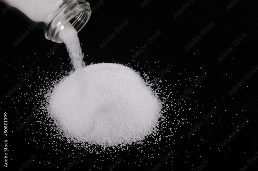 Pouring salt with from a salt pot