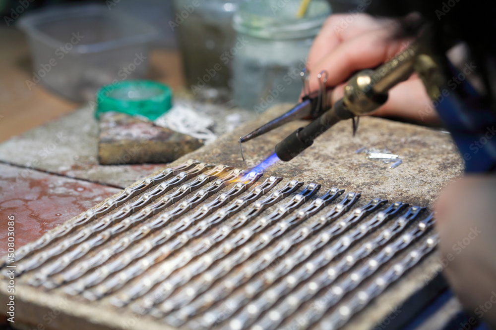 hands of jeweller at work silver soldering hands of jeweller at work silver soldering