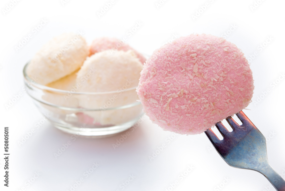 fork holding a piece of marshmallow and ready to eat fork holding a piece of marshmallow and ready to eat