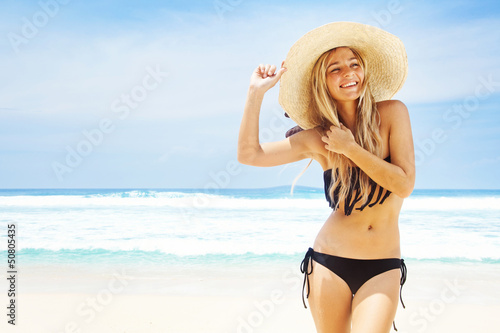 woman in hat on the beach