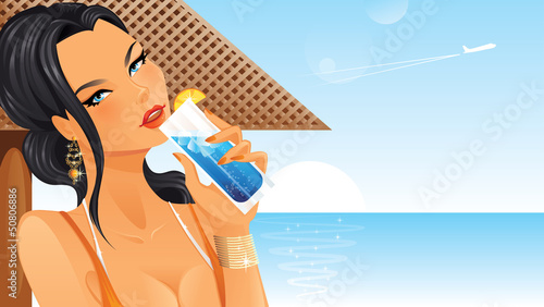Beautiful woman drinking cocktail on beach