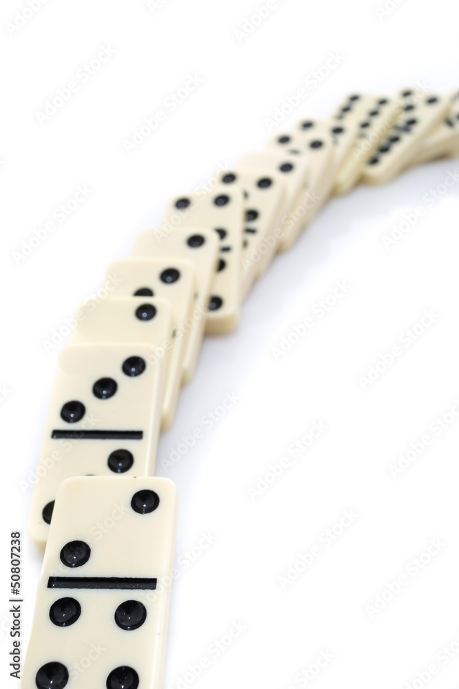 Fallen dominoes over white background Fallen dominoes over white background