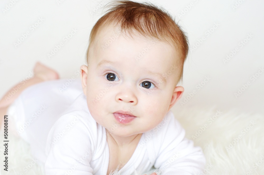 Portrait of the lovely six-months baby Portrait of the lovely six-months baby