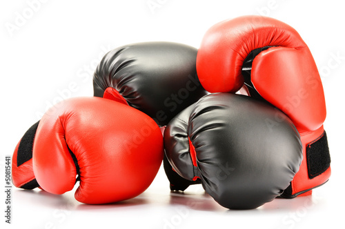 Two pairs of leather boxing gloves isolated on white
