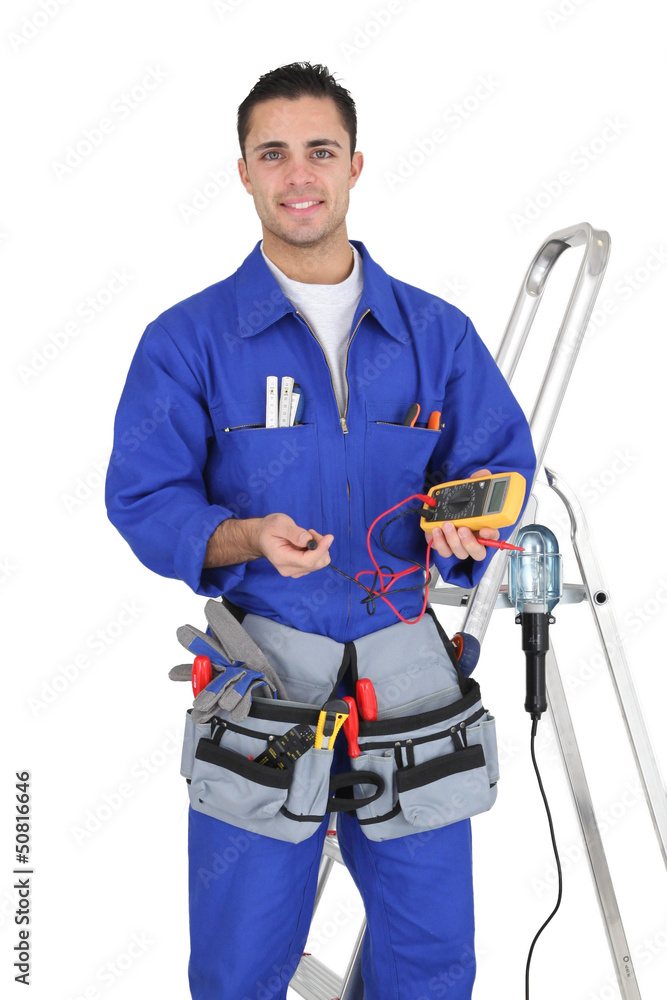 Handyman holding a multimeter Handyman holding a multimeter