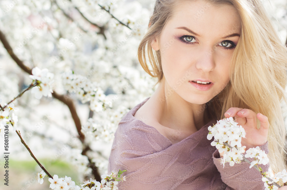 beautiful blonde girl in spring cherry garden beautiful blonde girl in spring cherry garden
