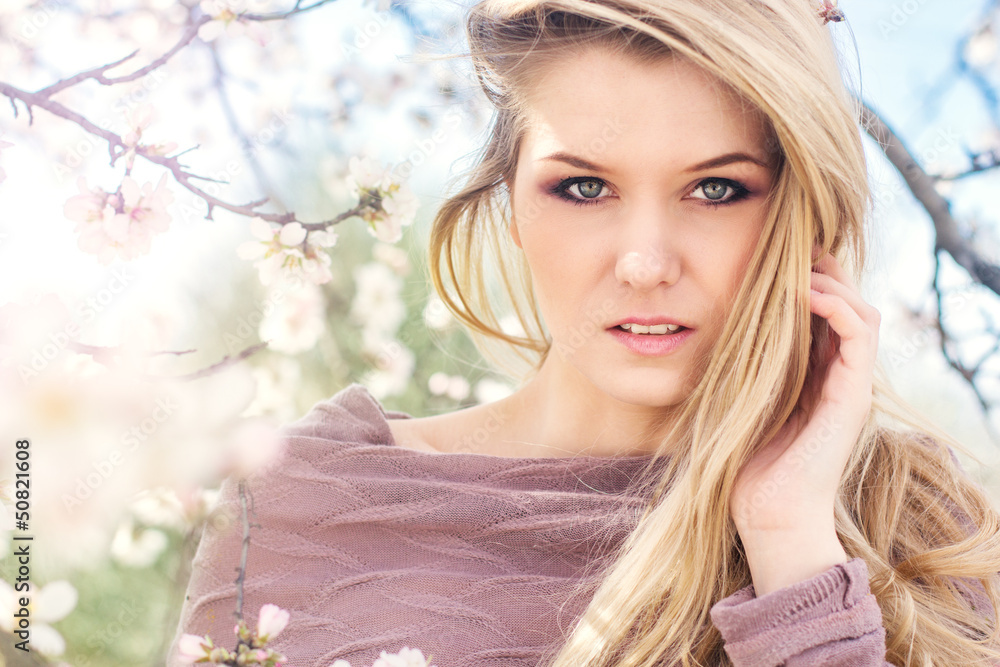 beautiful blonde girl in spring cherry garden beautiful blonde girl in spring cherry garden