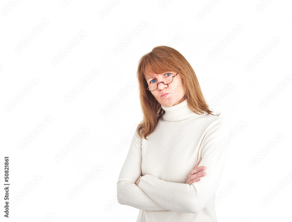 Woman with reading glasses looking doubtfully into the camera