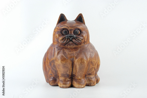 Wooden cat on white background