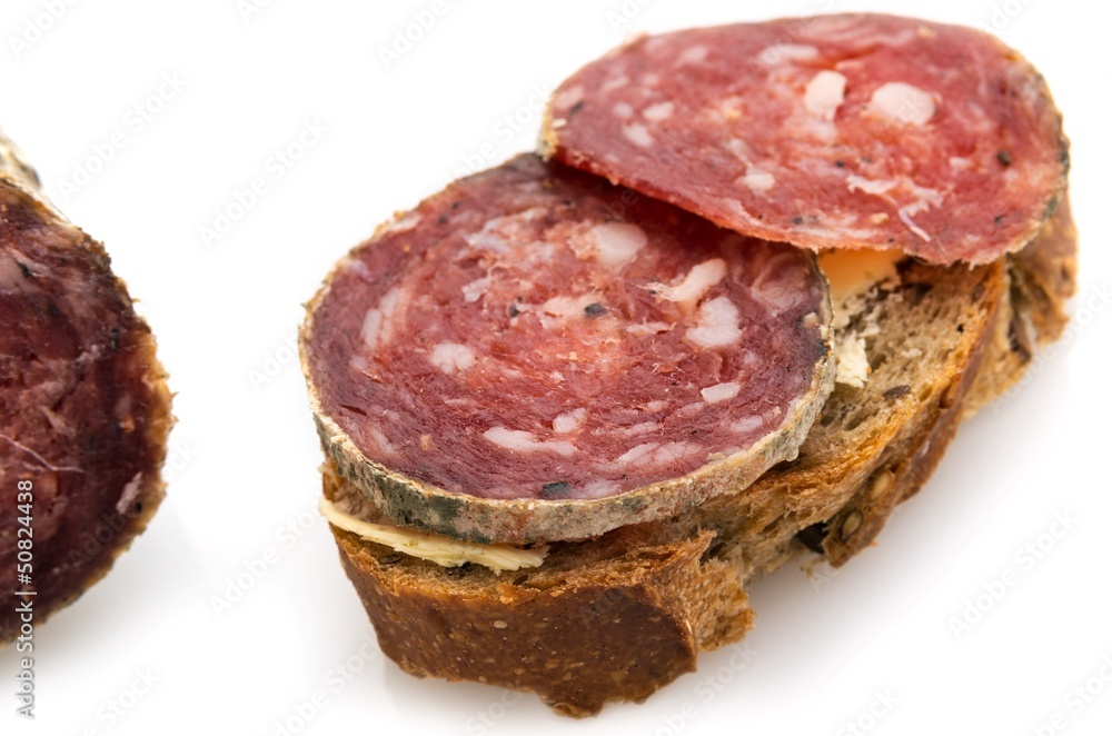 Slices of sausage on bread. Slices of sausage on bread.