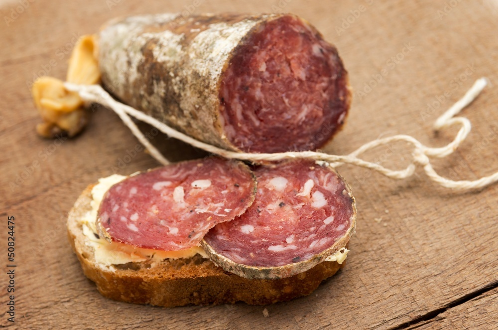 Slices of ​​sausage on bread.