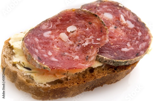 Slices of ​​sausage on bread.