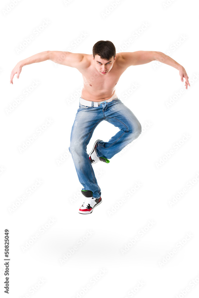 young handsome man in blue jeans jumping young handsome man in blue jeans jumping